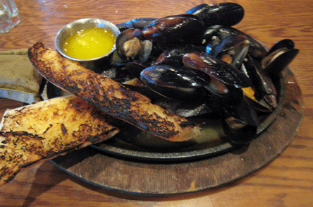Sizzling mussels sautéed in white wine & garlic