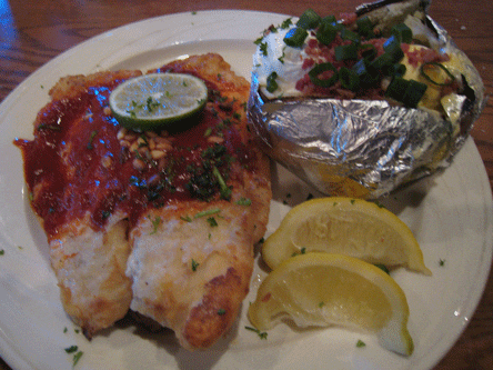Pinon Crusted Tilapia topped with red chile butter