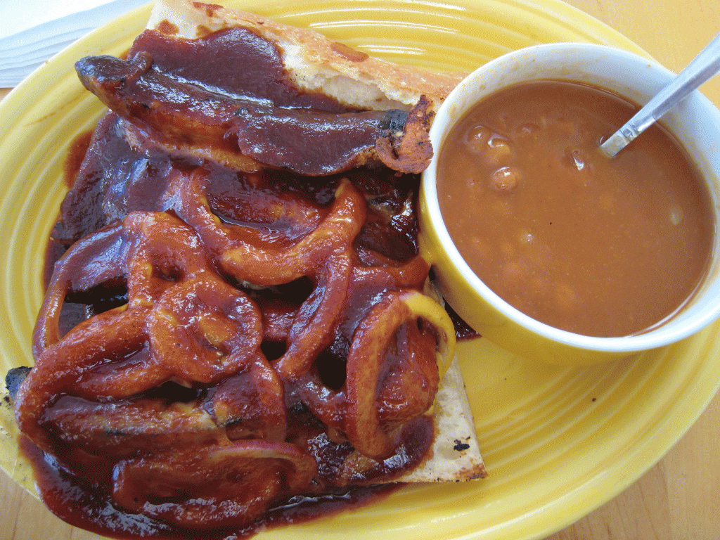 Links sandwich with Cheddar cheese and onions