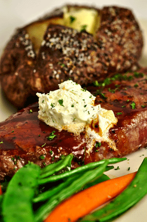 A succulent steak with baked potato and all the trimmings (Courtesy of Sergio Salvador)