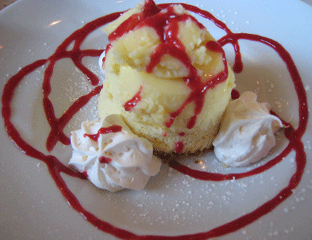 Luscious Lemon Pudding Cake with Raspberry Sauce