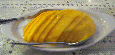 Sweet sticky rice with coconut milk and fresh ripe mango (Seasonal)