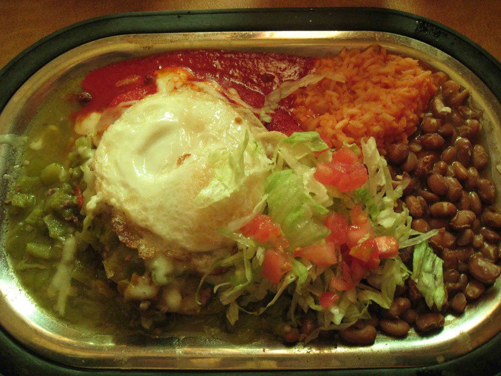 Ground beef enchilada with a fried egg on top