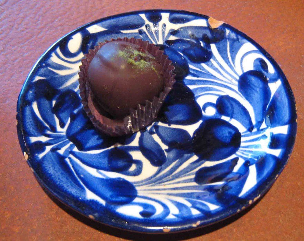 A truffle of Chaya, Mesquite, Prickly Pear Fruit Nectar and Oaxacan Chile Pasilla