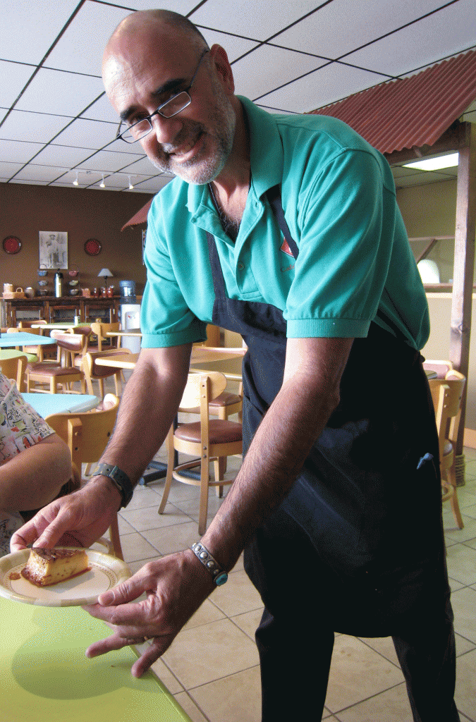 Carlos Figueroa, one of the restaurant proprietors delivers quesillo to our table