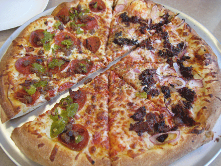 A large pizza: half Ranchero and half barbecue beef