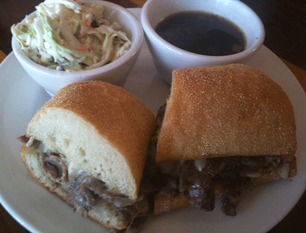 Prime Rib Dip w/ Green Chile Au Jus — Oven Roasted Prime Rib sliced thin & Swiss and served with our au jus with a touch of green chile.