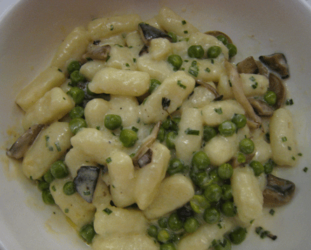 Potato gnocchi with porcini, cream and peas