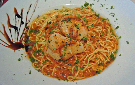 Pan-Seared Sea Scallops: Fresh angel hair tossed with spicy tomato, red sweet pepper sauce with shellfish broth and herbs