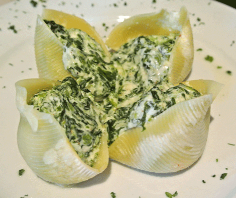 Stuffed Shells: Giant pasta shells stuffed with a tantalizing blend of cheeses and spinach served with marinara.
