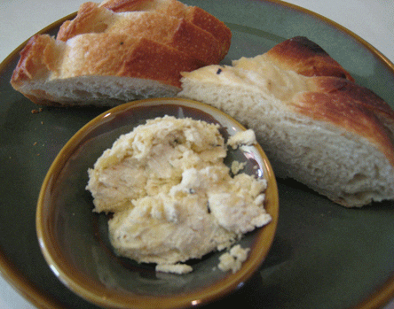 Housemade Foccacia Bread and Fano Bakery Baguettes With Butter Compound made with garlic and thyme