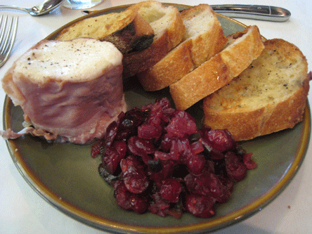 Local goat cheese wrapped in prosciutto with toasted baguettes and a black pepper-cranberry chutney