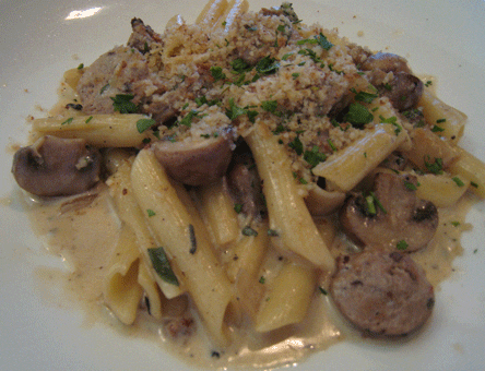 Fontina cheese Pasta with sage, chicken sausage, cherries, herbs and port wine topped with bread crumbs.