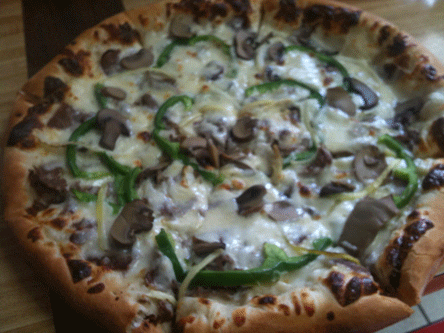 Philly Cheesesteak Pizza, a rich, cheesy indulgence