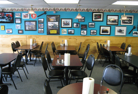 The interior at Wings & Things--west wall festooned with car images